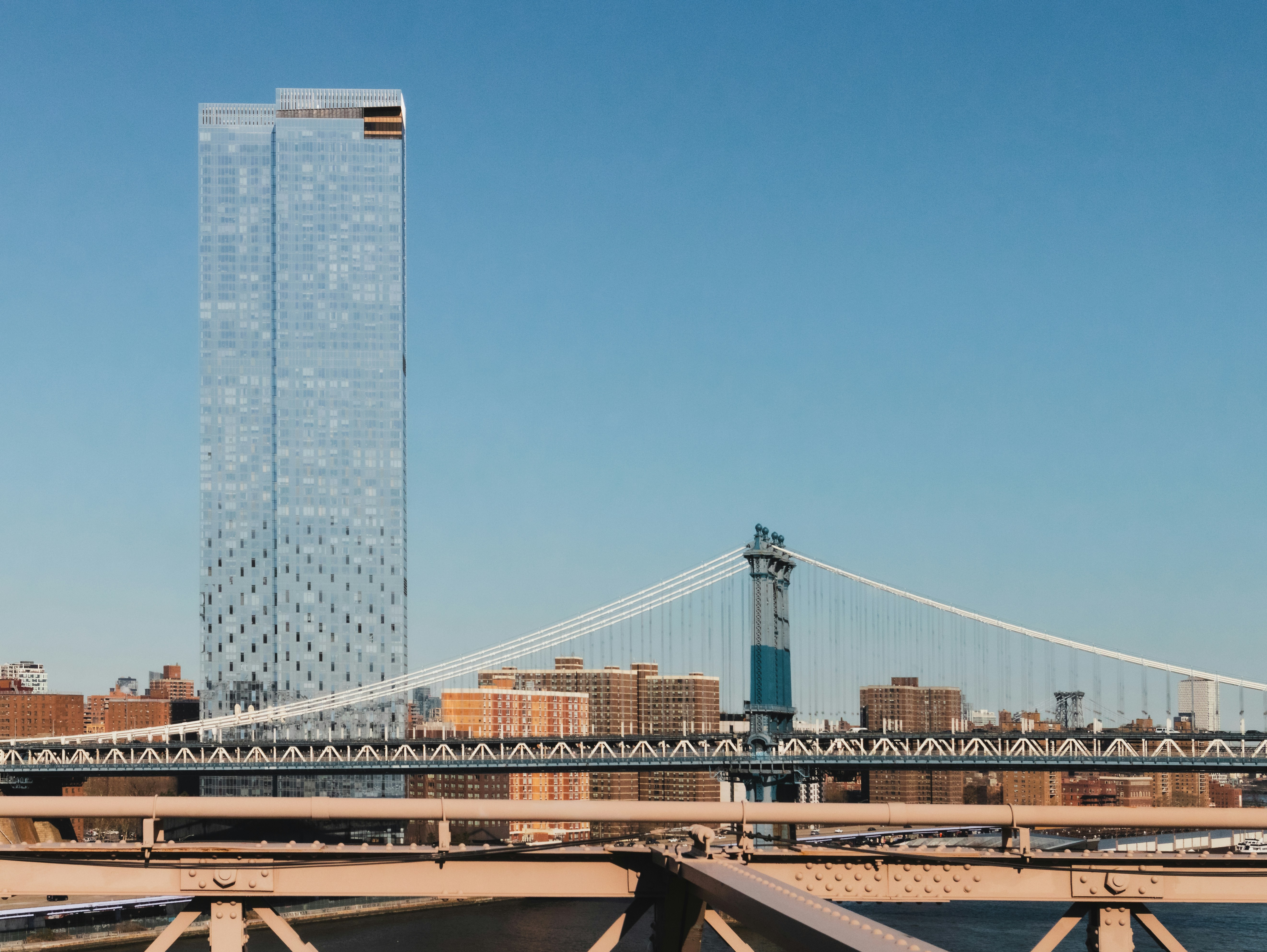 A bridge with a tall building in the background