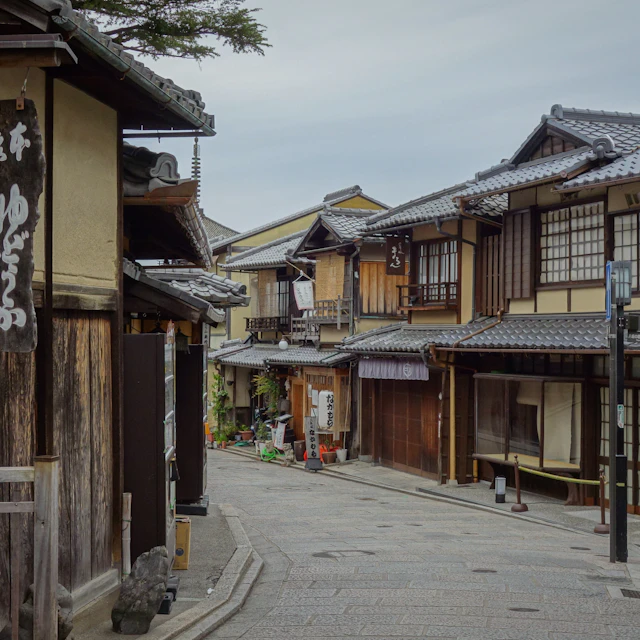 A narrow street lined with traditional wooden buildings