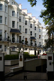 A large white building with many balconies
