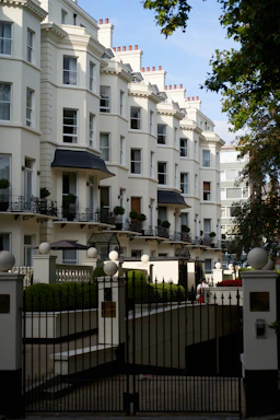 A large white building with many balconies