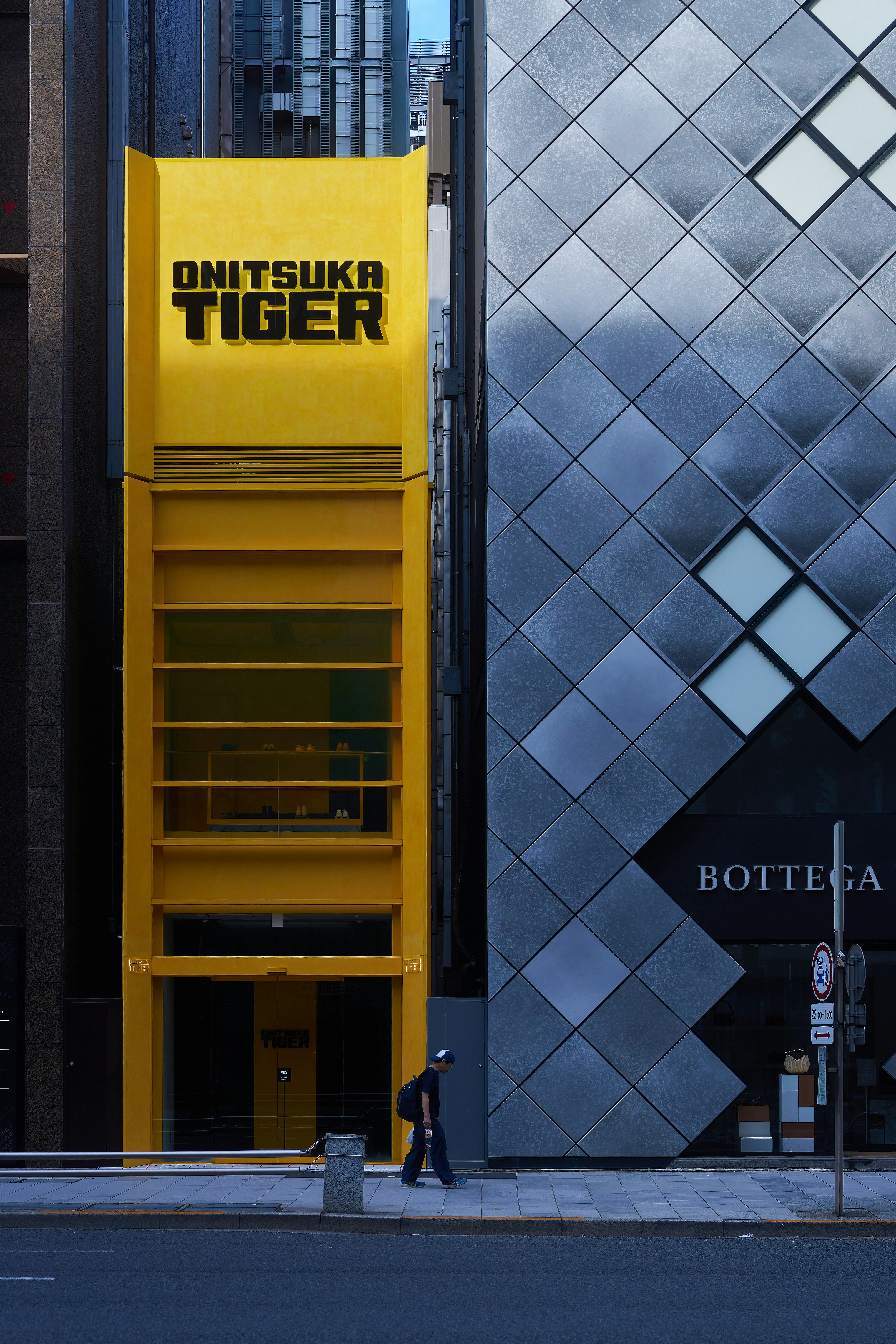 A tall building with a sign on the side of it