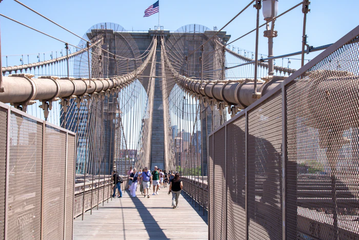 People walking across a bridge