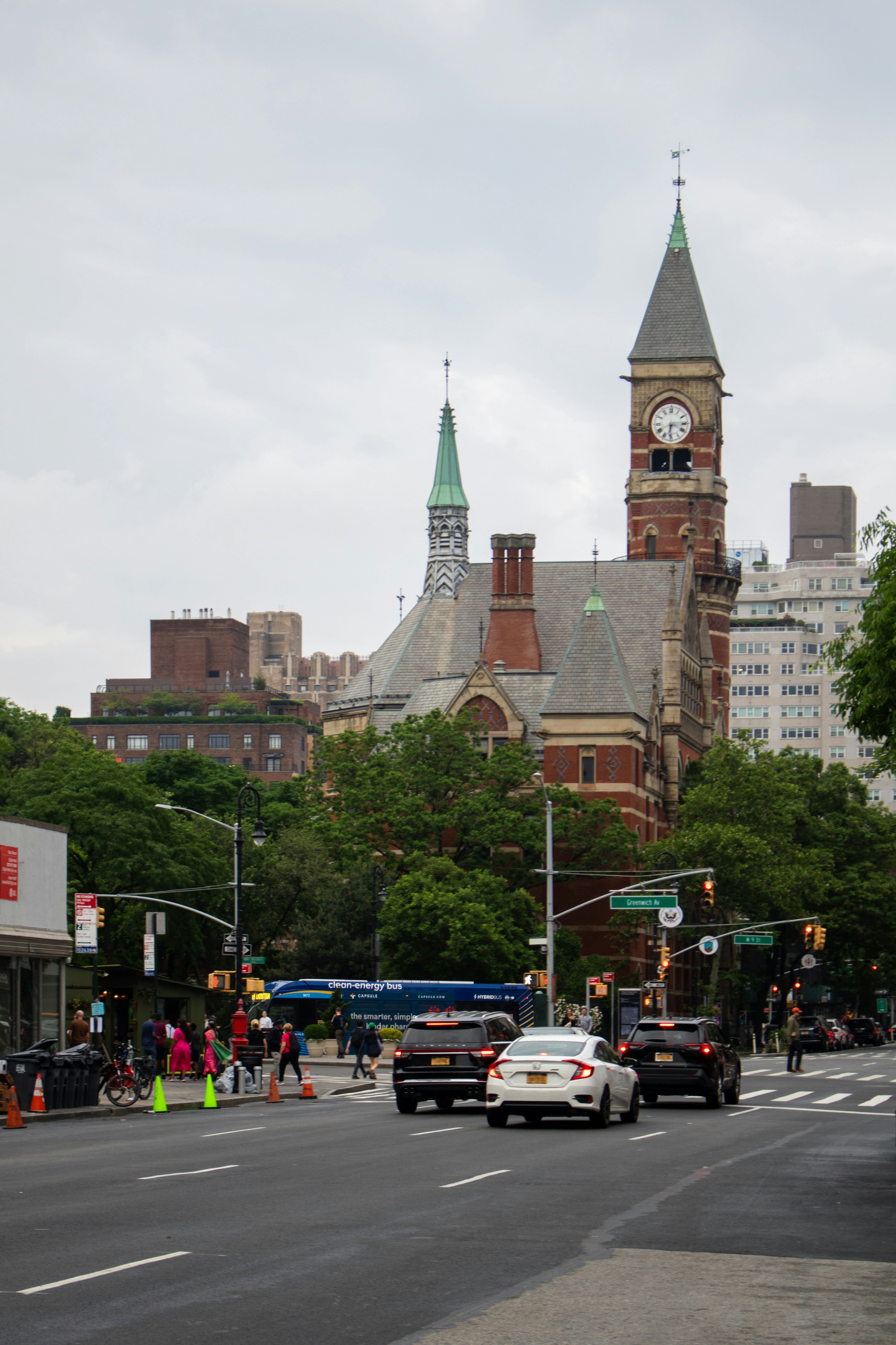 A city street with a clock tower in the background