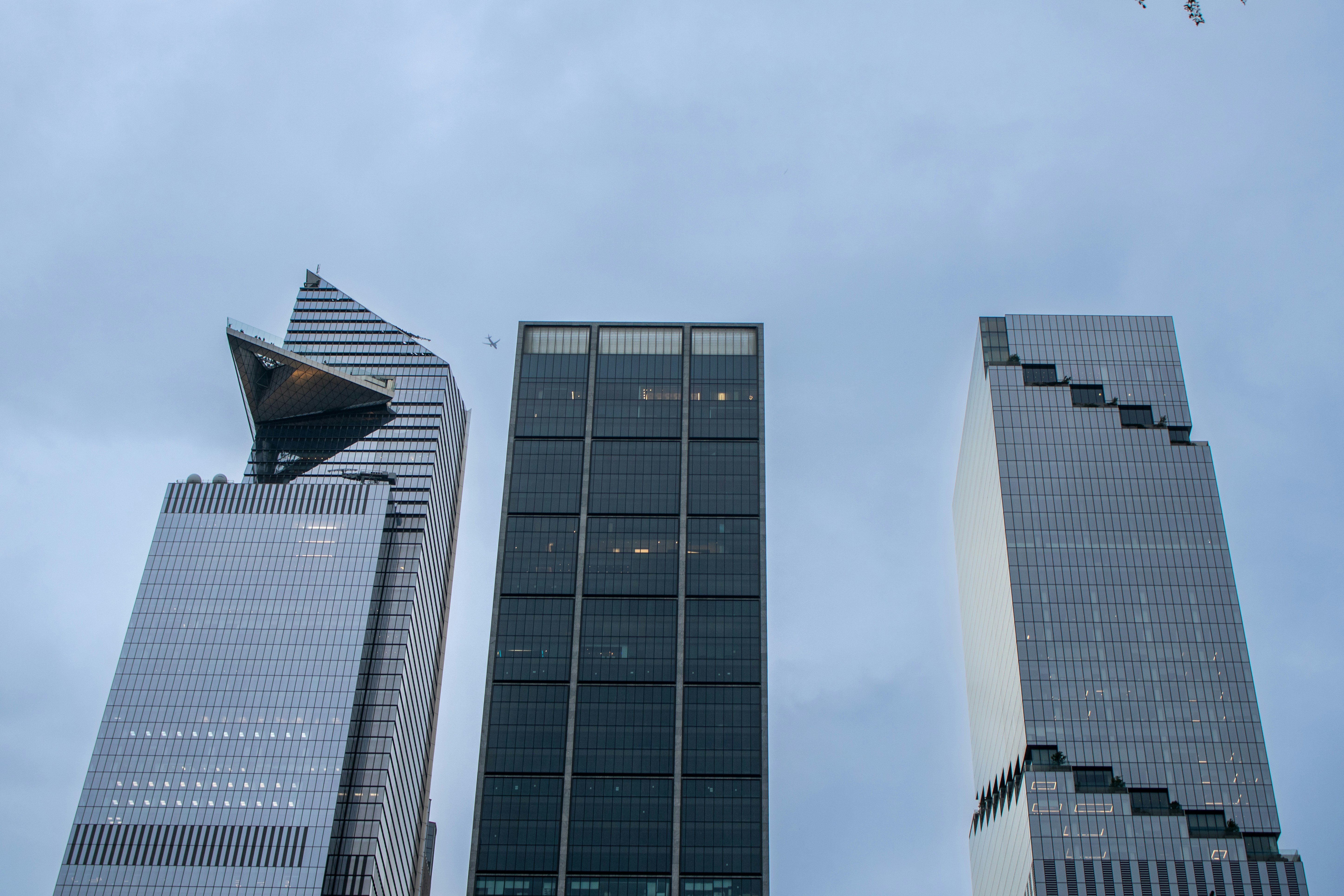 A couple of tall buildings sitting next to each other