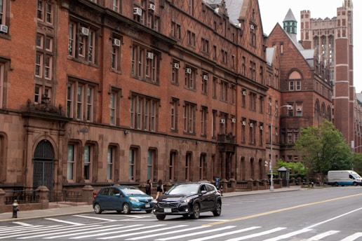 A city street with cars parked on the side of it