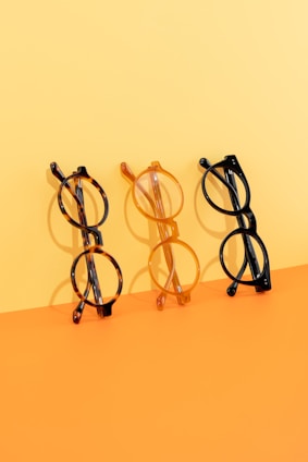 Three pairs of glasses sitting next to each other