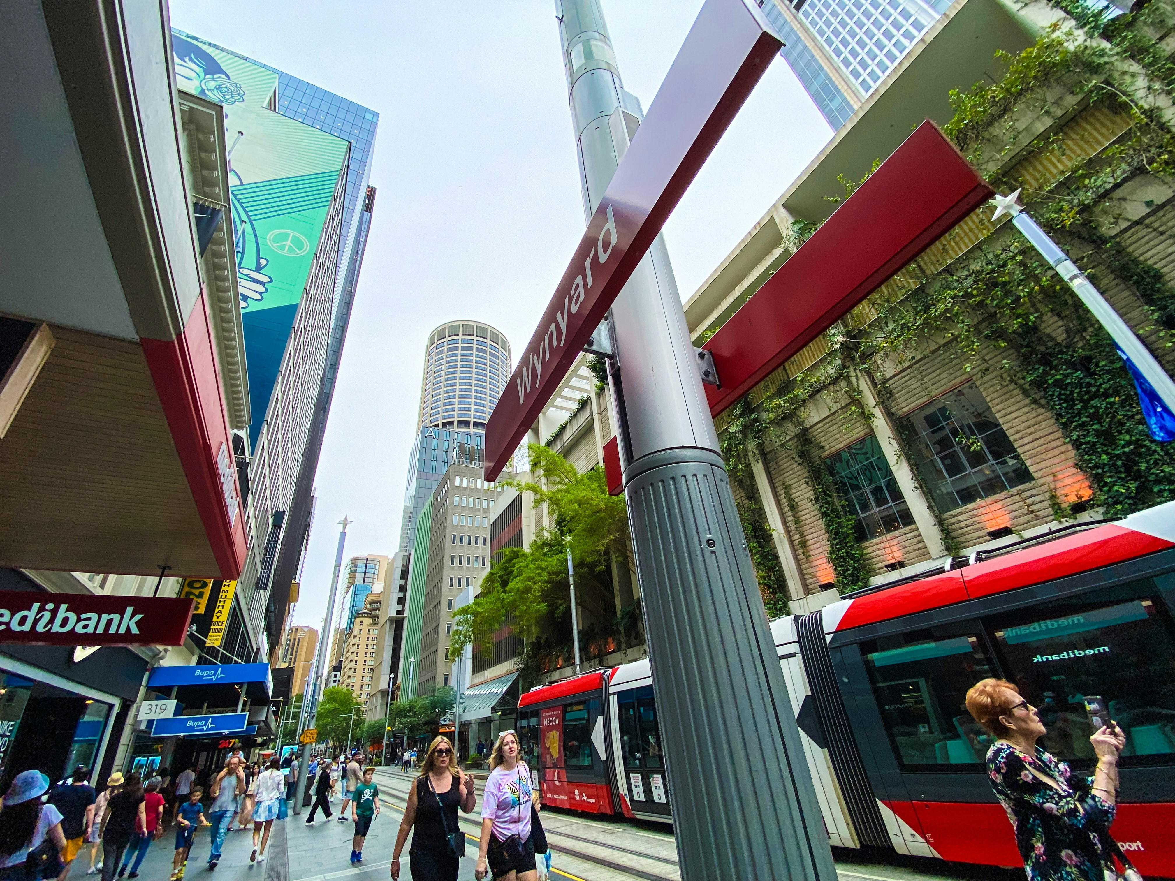 A city street filled with lots of people