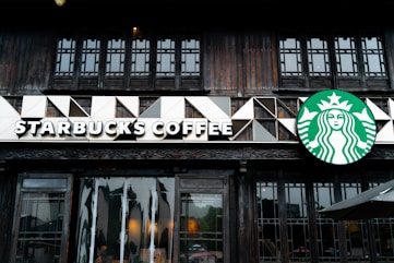A starbucks sign on the side of a building
