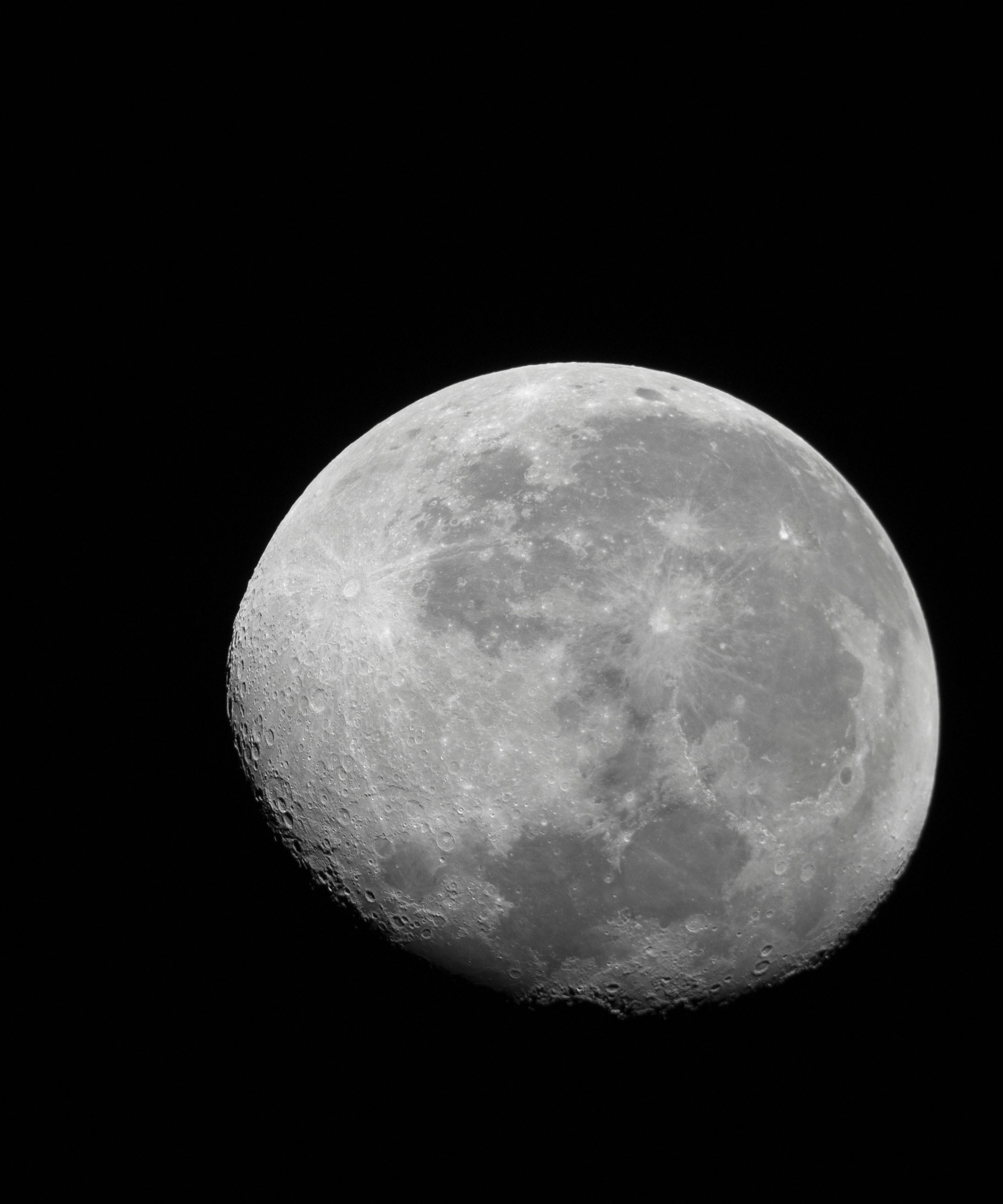 A full moon in the sky with a black background