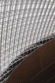 A large metal structure with a clock on top of it