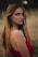 A woman in a red dress posing for a picture