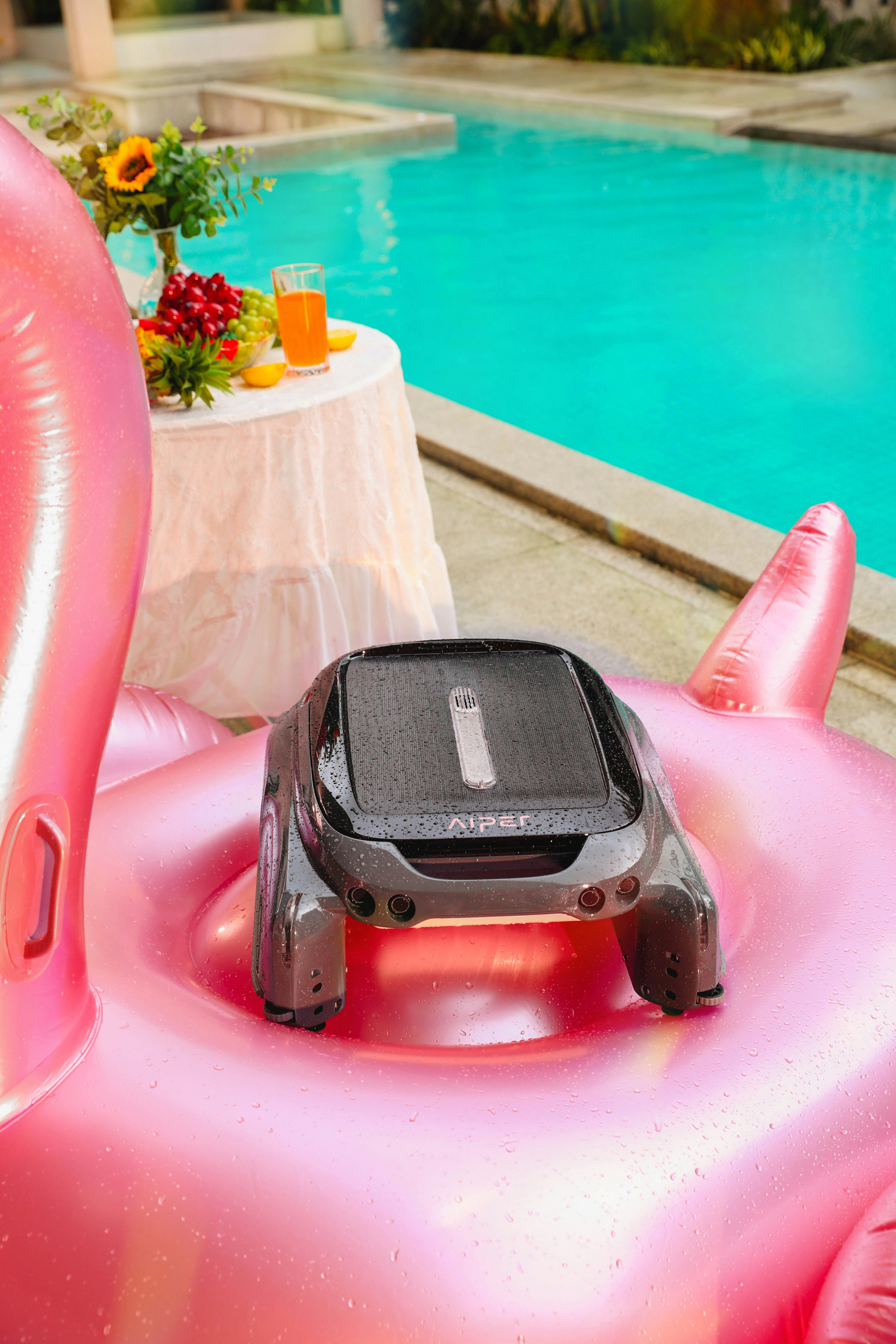 An inflatable pool with a remote control device on top of it
