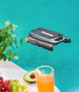 A cell phone floating in a pool of water