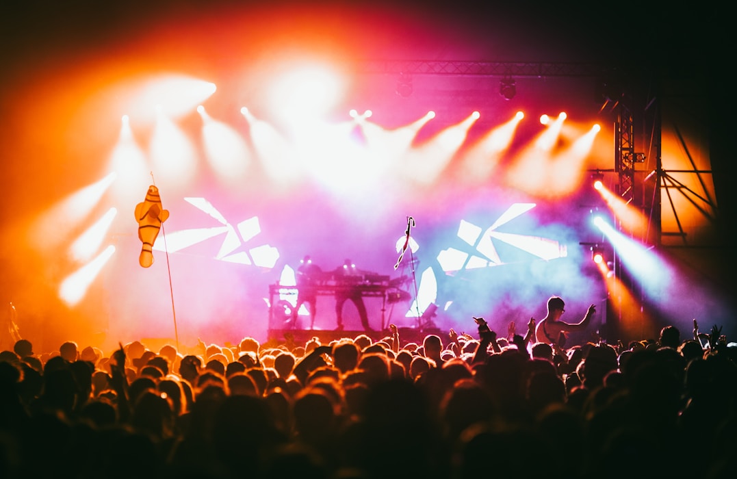 Concert crowd watching performers on stage