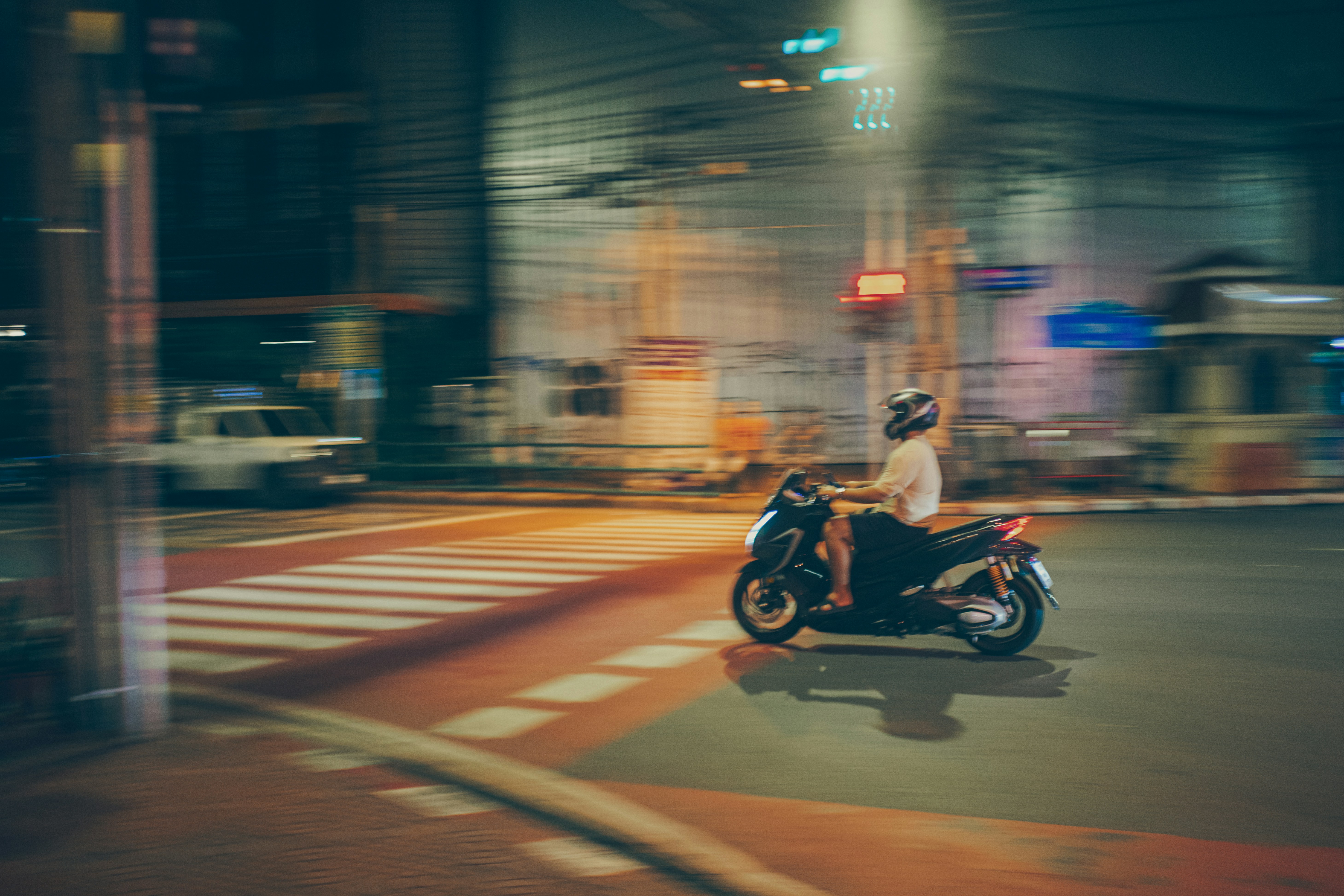 A person riding a motorcycle on a city street