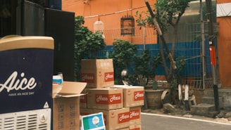 Boxes are stacked up on the side of the street