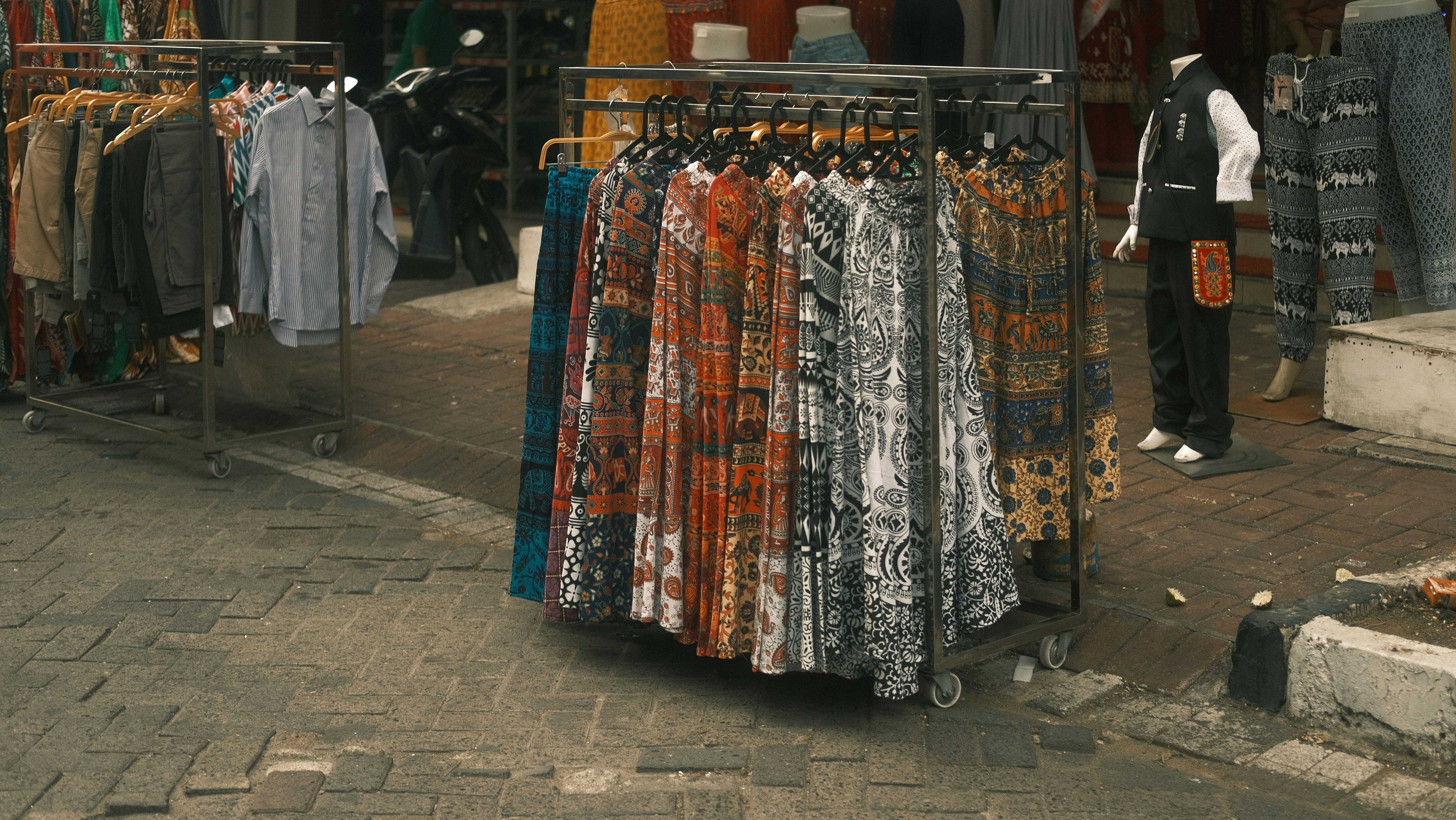 A man in front of a clothing store