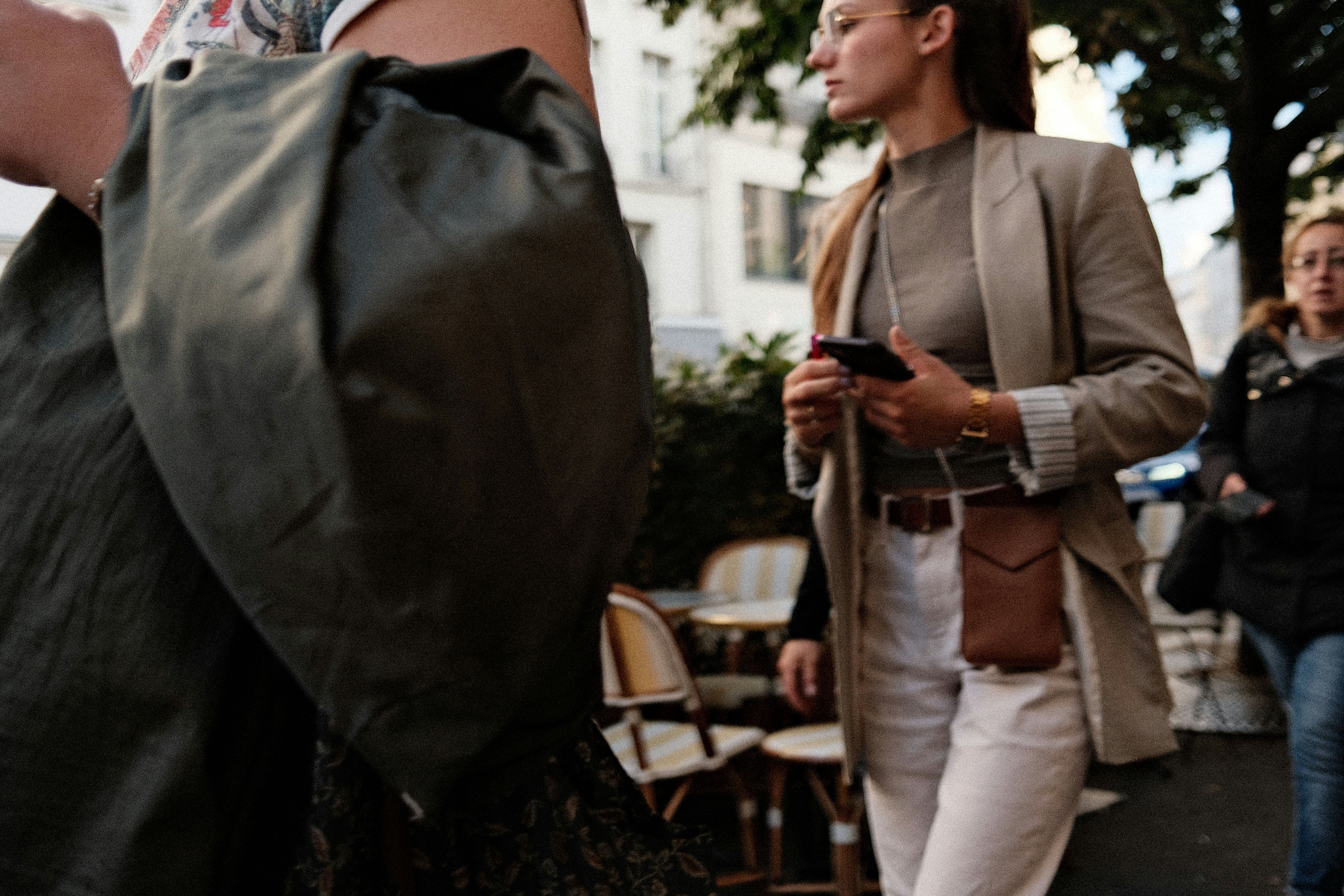 A group of people walking down a street