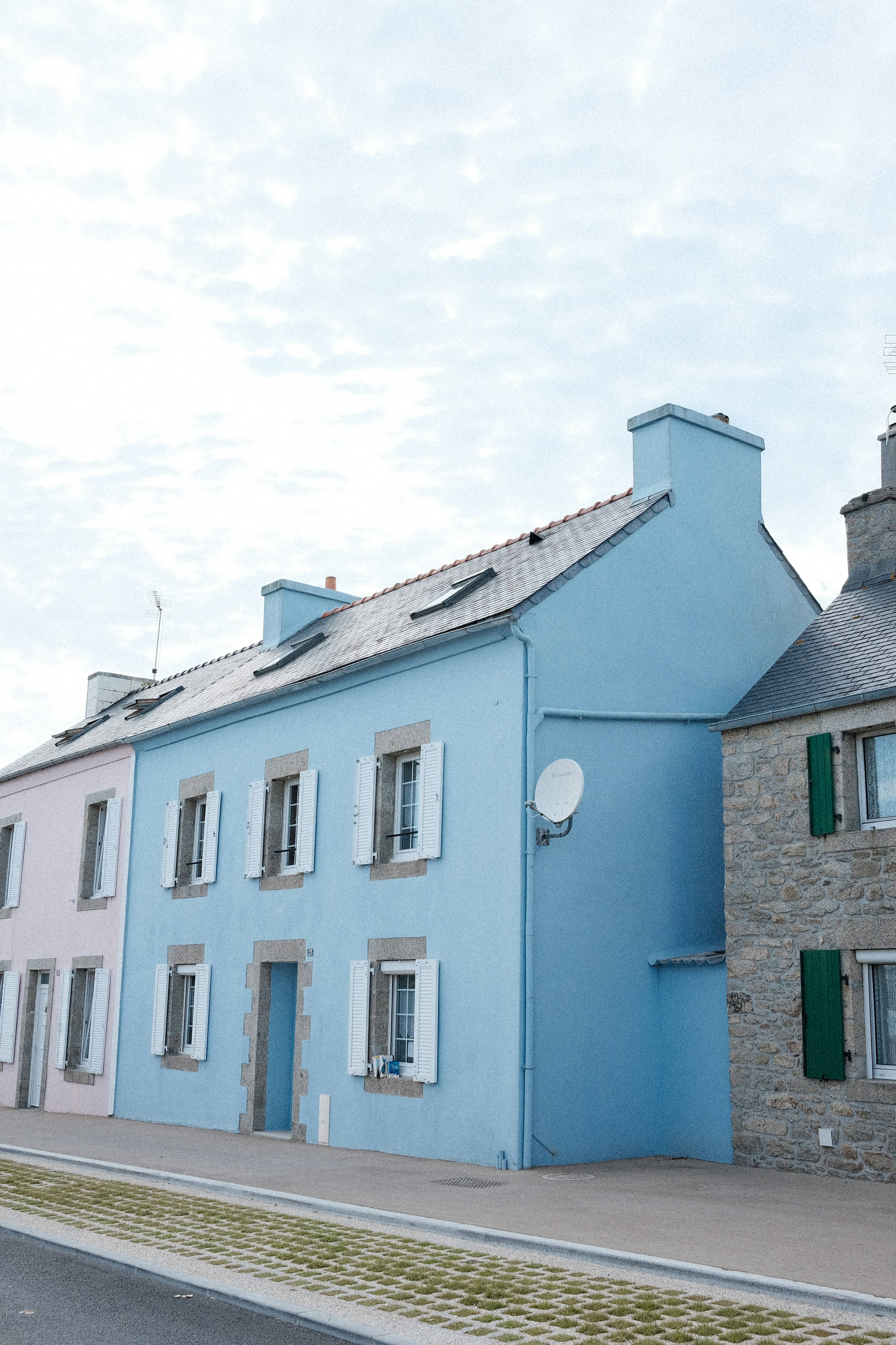 A blue building with a clock tower on top of it photo – Free House ...