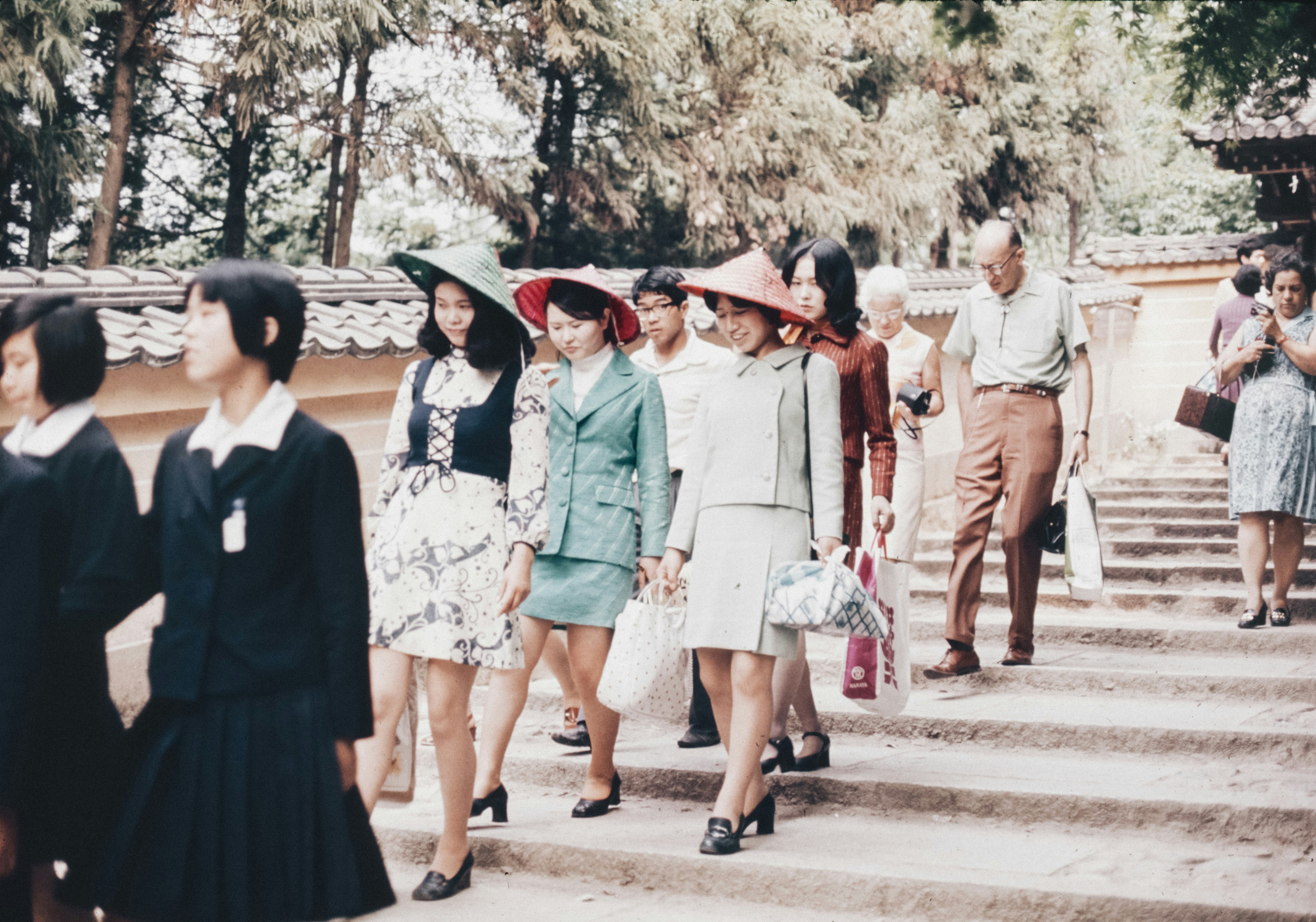 A group of people walking up some steps
