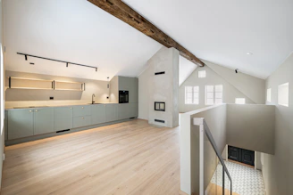 A room with a wooden floor and white walls