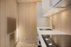 A kitchen with a stove top oven next to a sink