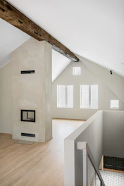 A room with a wooden floor and white walls