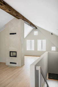 A room with a wooden floor and white walls