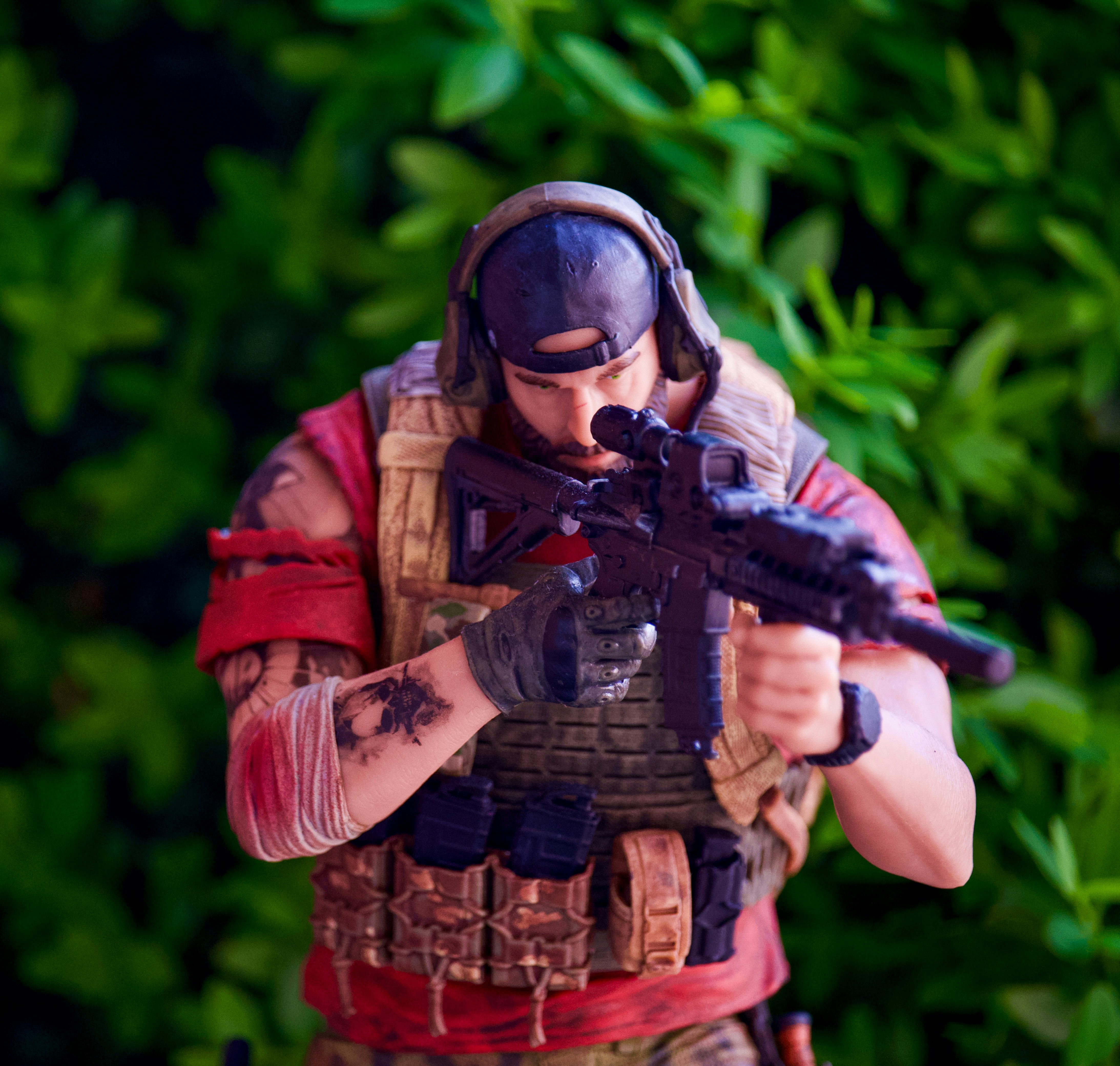 A figurine of a man with a gun