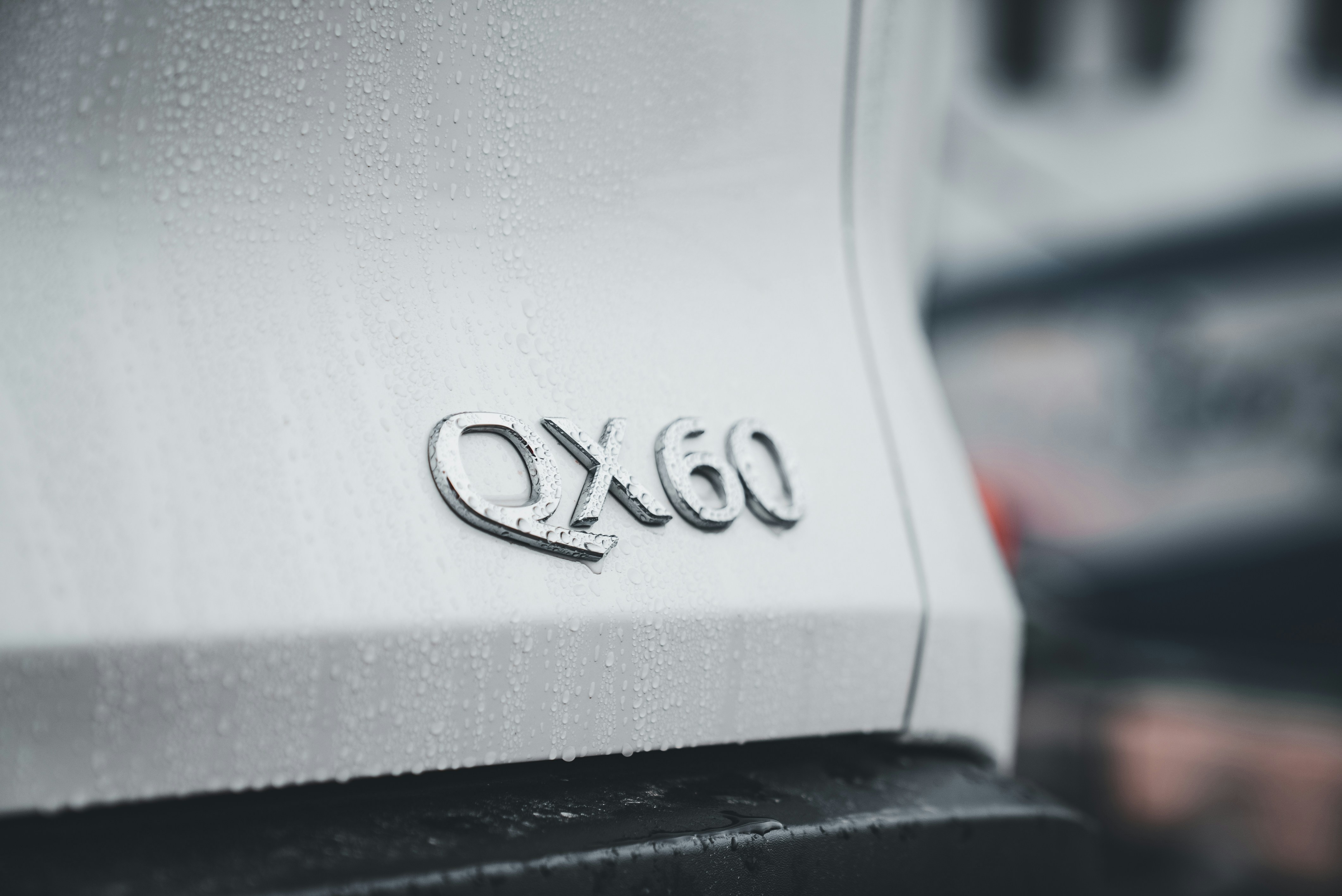 A close up of a car's emblem on the side of a vehicle