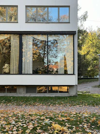 A white house with a large glass window