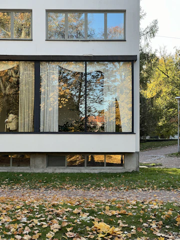 A white house with a large glass window