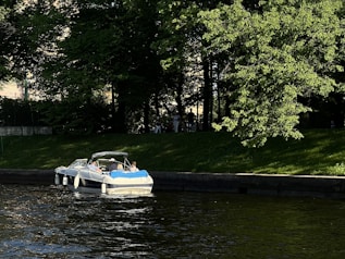 Family boating on the Severn River, enjoying quiet river lifestyle.
