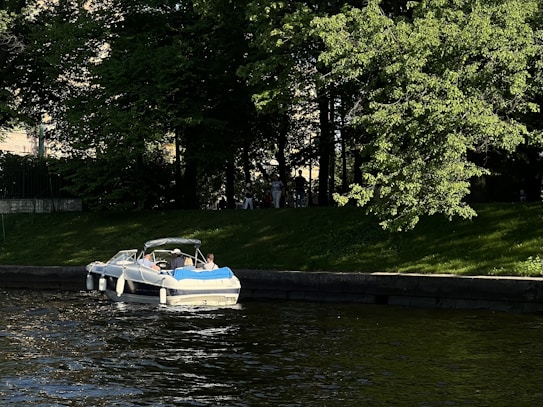 Family boating on the Severn River, enjoying quiet river lifestyle.