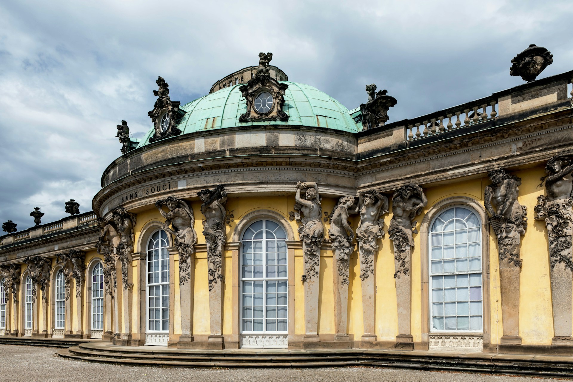 A large building with a green dome on top of it