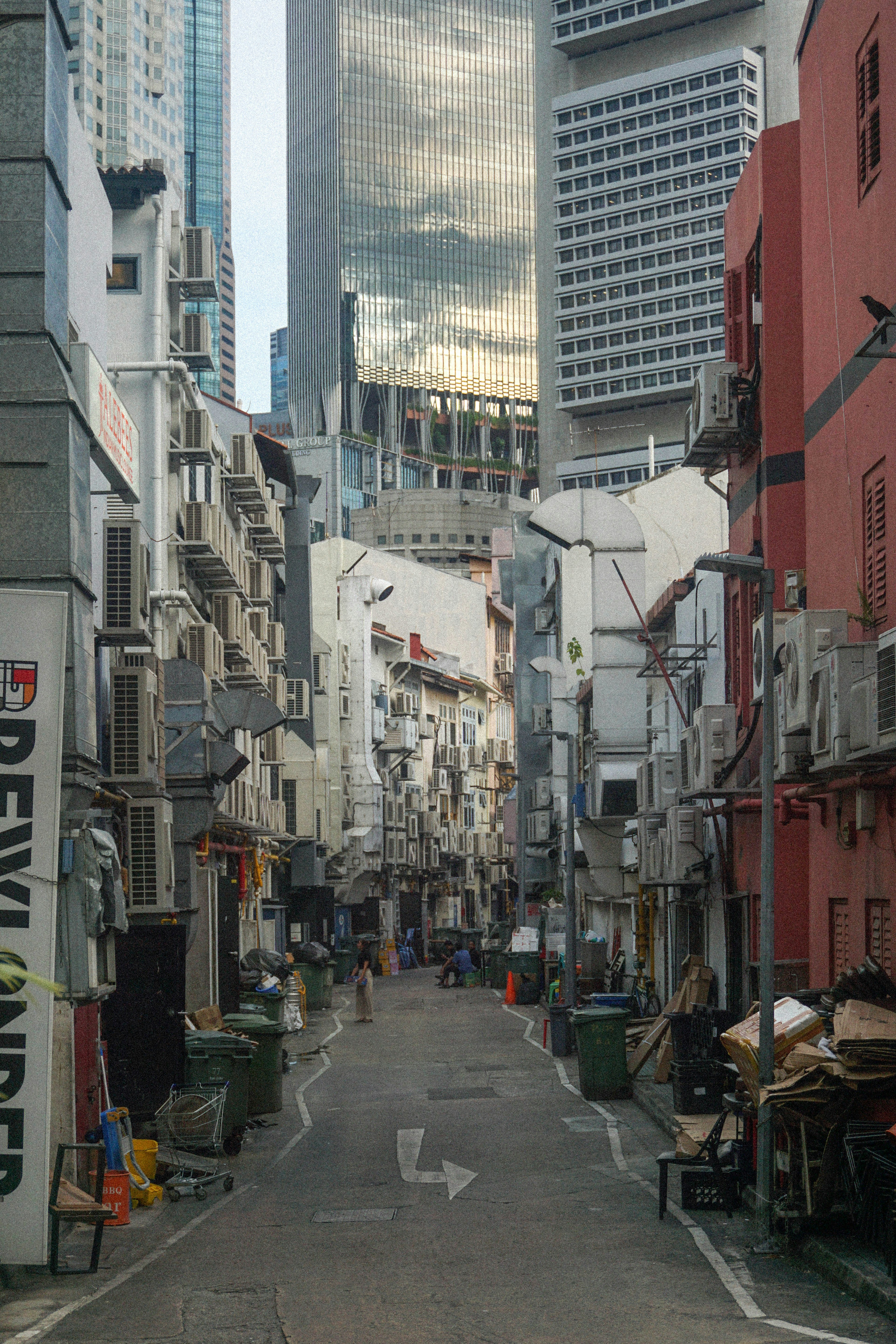 A narrow city street lined with tall buildings