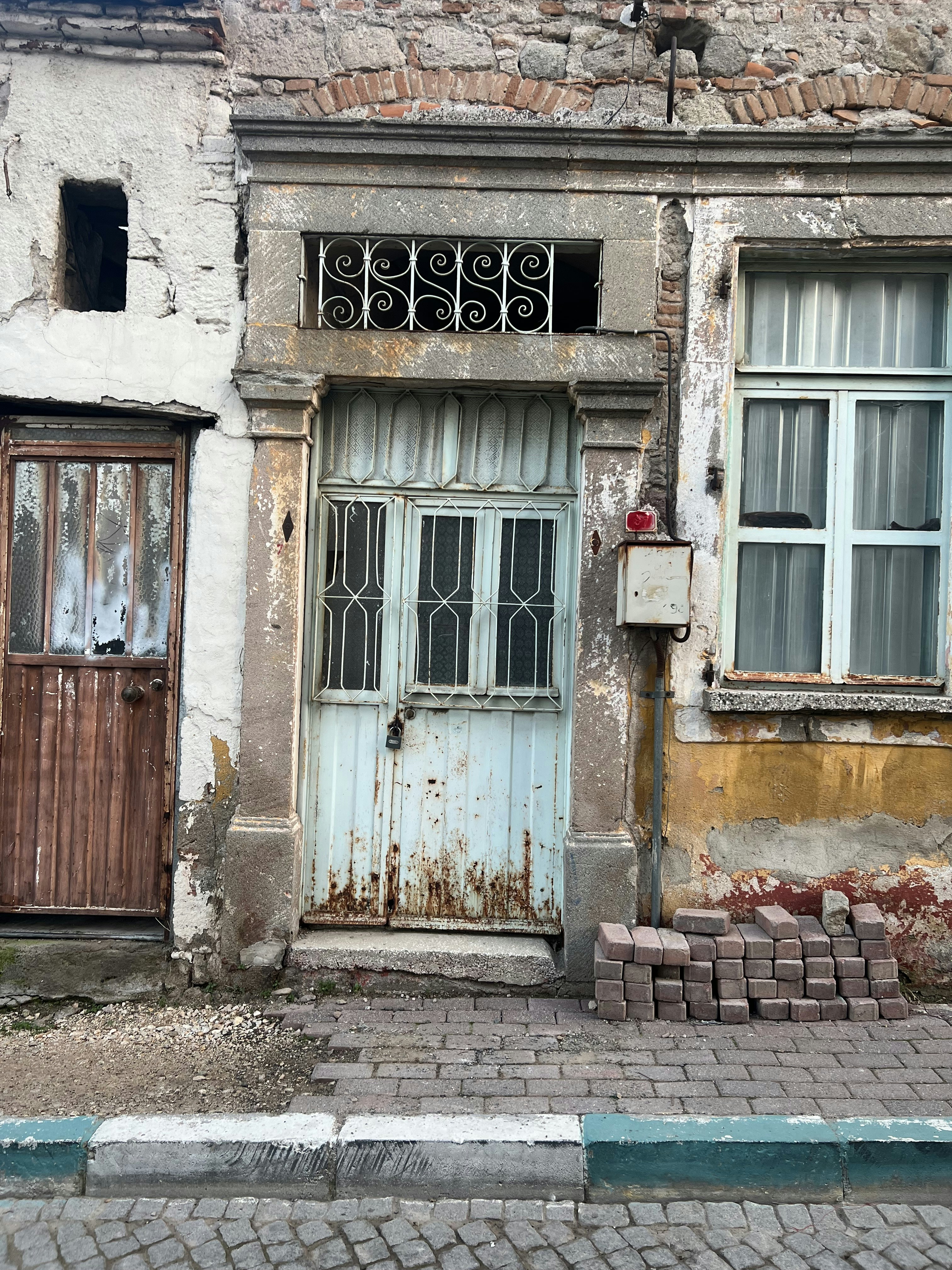 An old building with two doors and windows