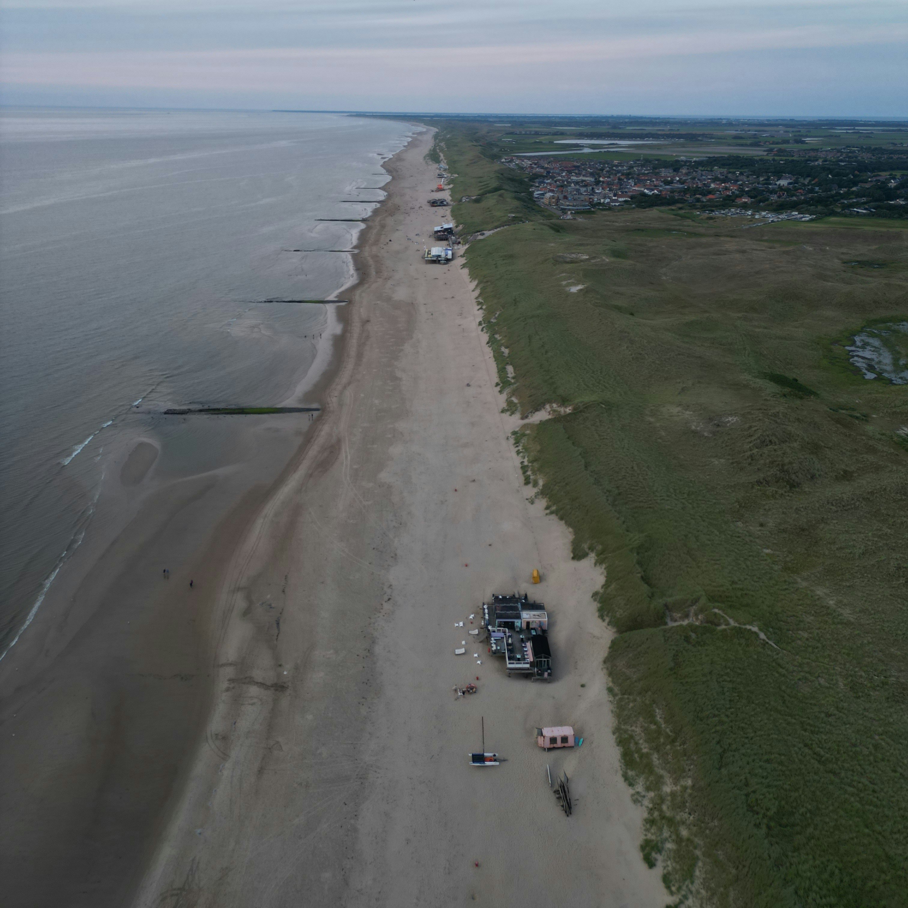 An aerial view of a beach and a body of water