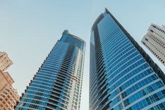 A couple of tall buildings sitting next to each other