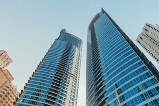 A couple of tall buildings sitting next to each other