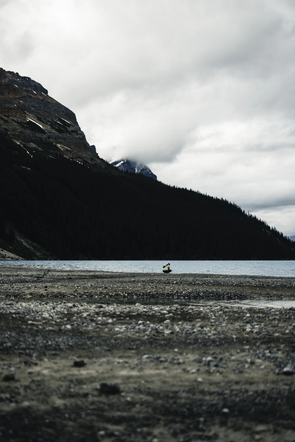 Lone boat on the shore of a mountain lake