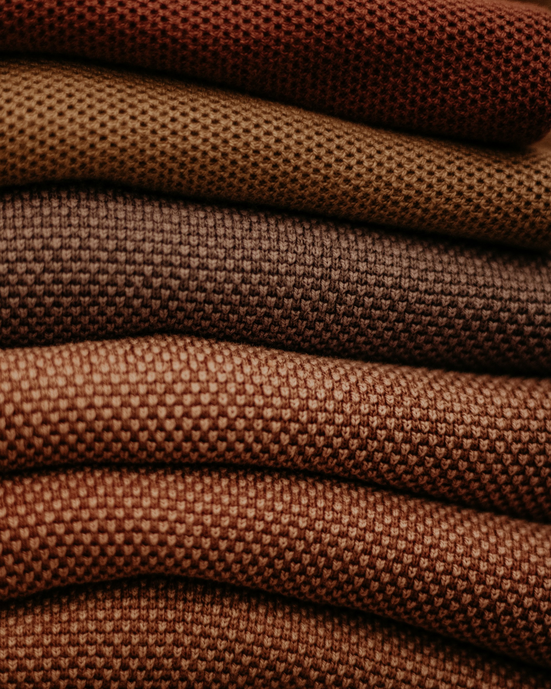 A stack of different colored fabrics on top of each other