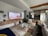 A living room filled with furniture and a flat screen TV