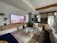 A living room filled with furniture and a flat screen TV
