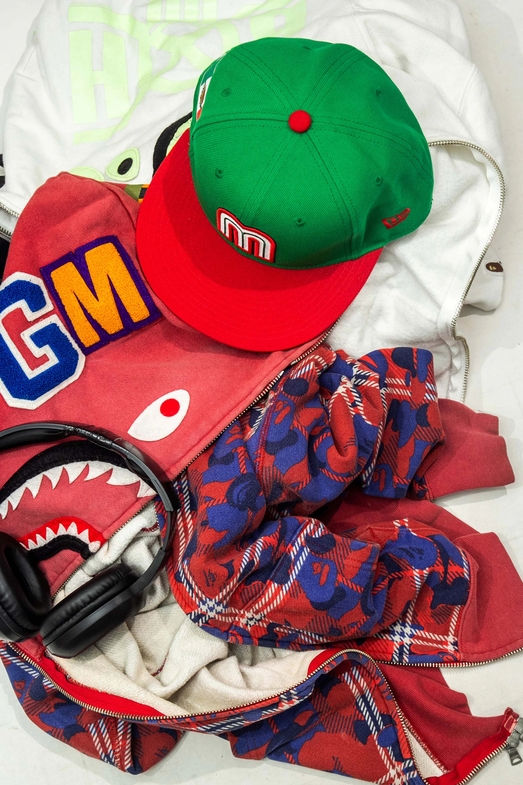 A pile of clothing with a hat on top of it