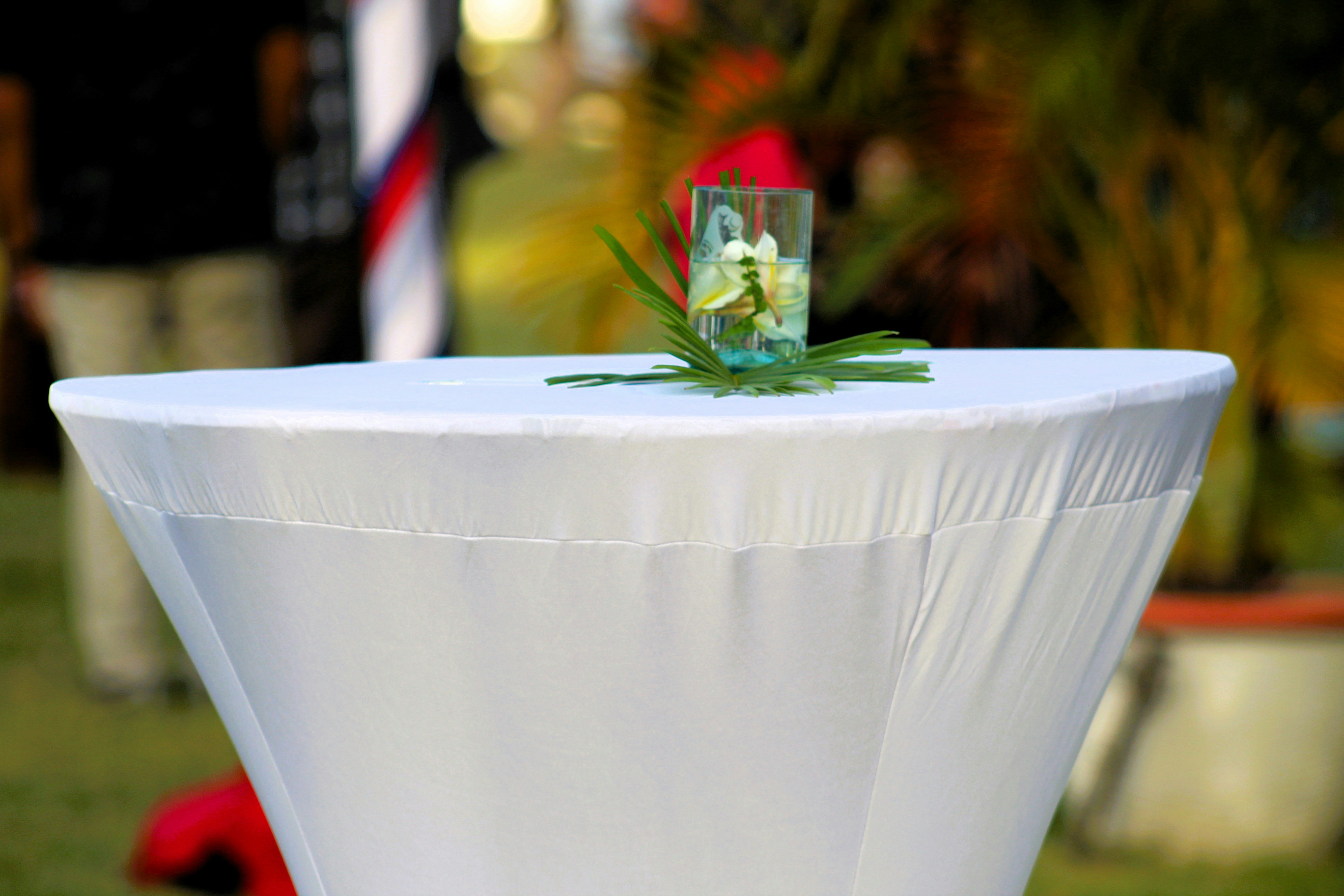 A white table topped with a white table cloth