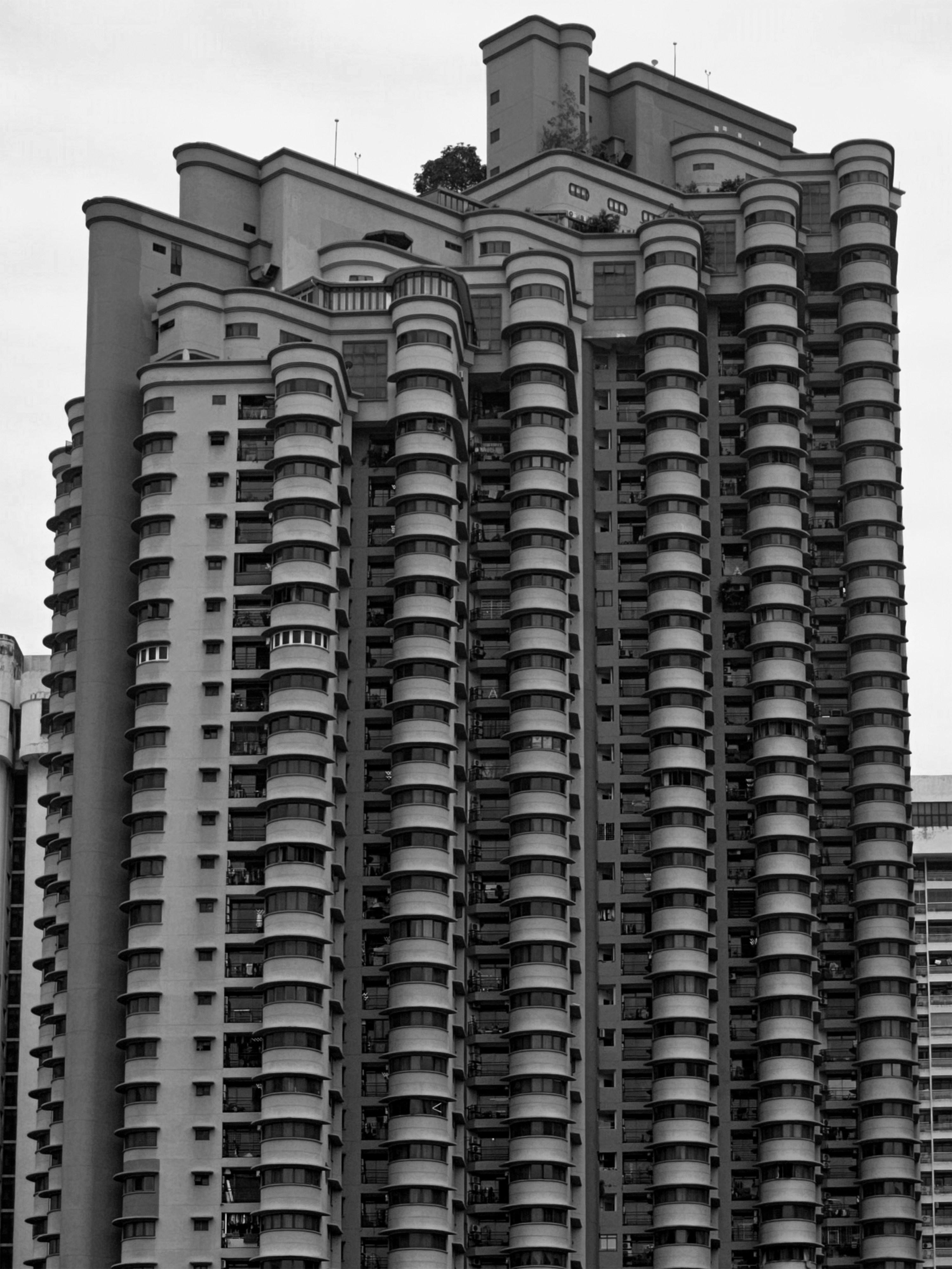 A black and white photo of a very tall building