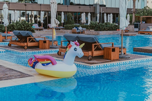 An inflatable unicorn float in the middle of a swimming pool