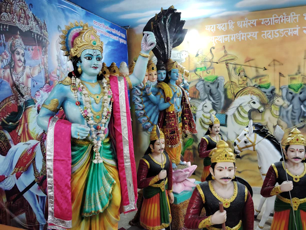 A group of statues of deities in a room