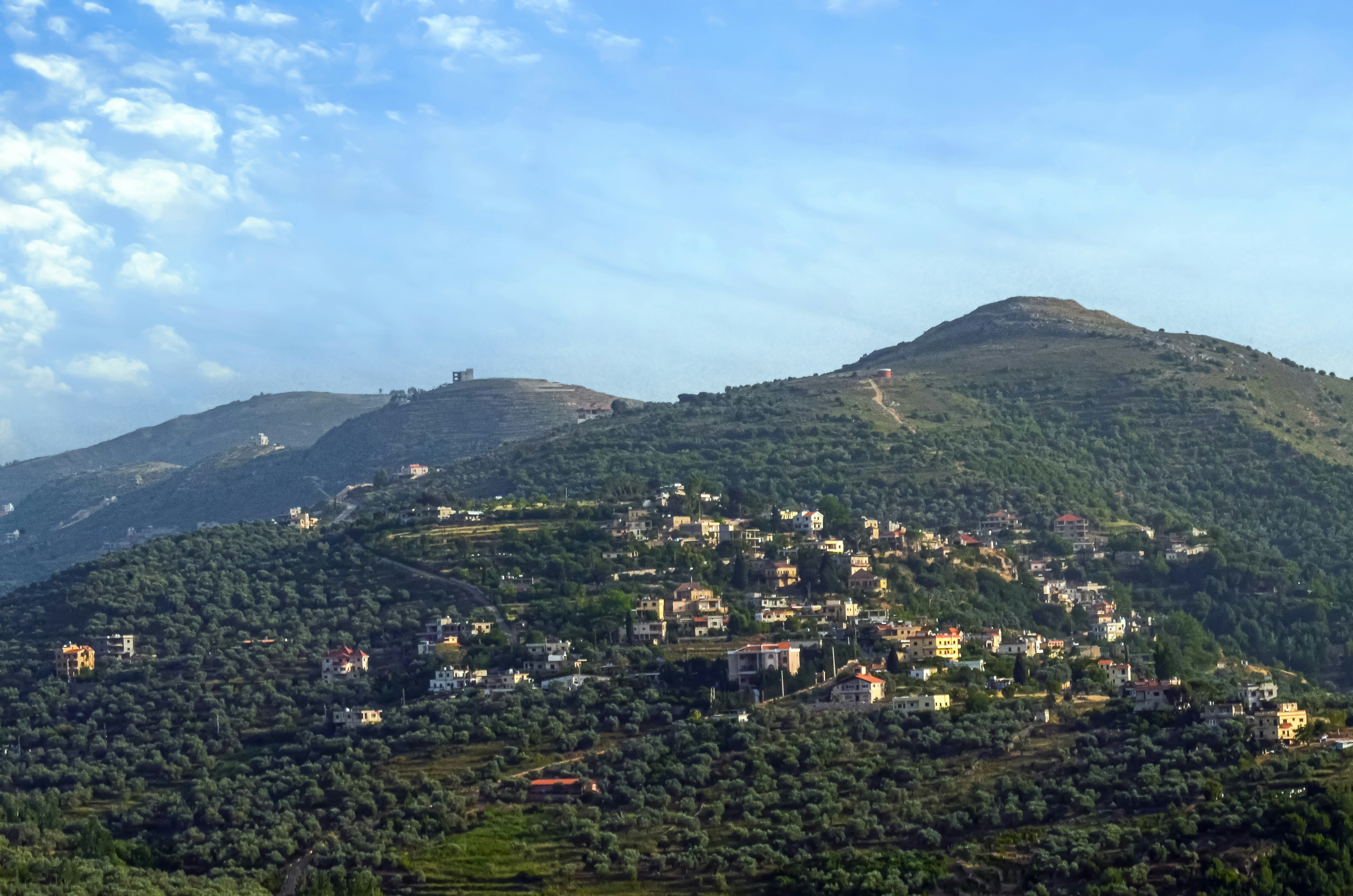 A hill with a village on top of it